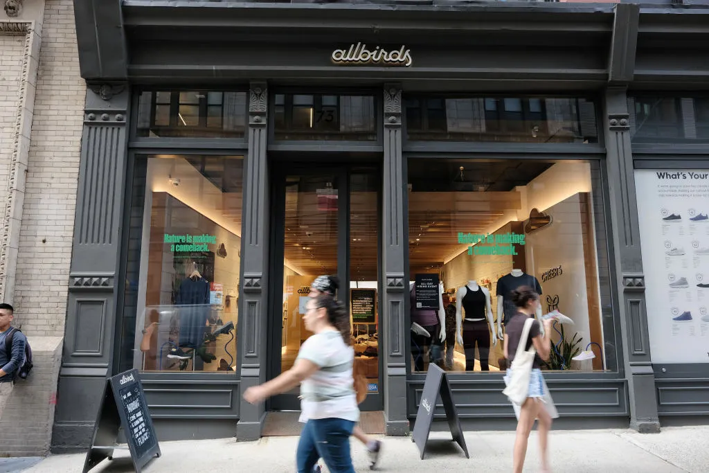 NEW YORK, NEW YORK - AUGUST 31: People walk past an Allbirds store, a maker of sustainable shoes, in lower Manhattan on August 31, 2021 in New York City. The shoe company has announced that it is preparing an initial public offering (IPO). The company has lost money and expects it will continue to be unprofitable for the foreseeable future. (Photo by Spencer Platt/Getty Images)