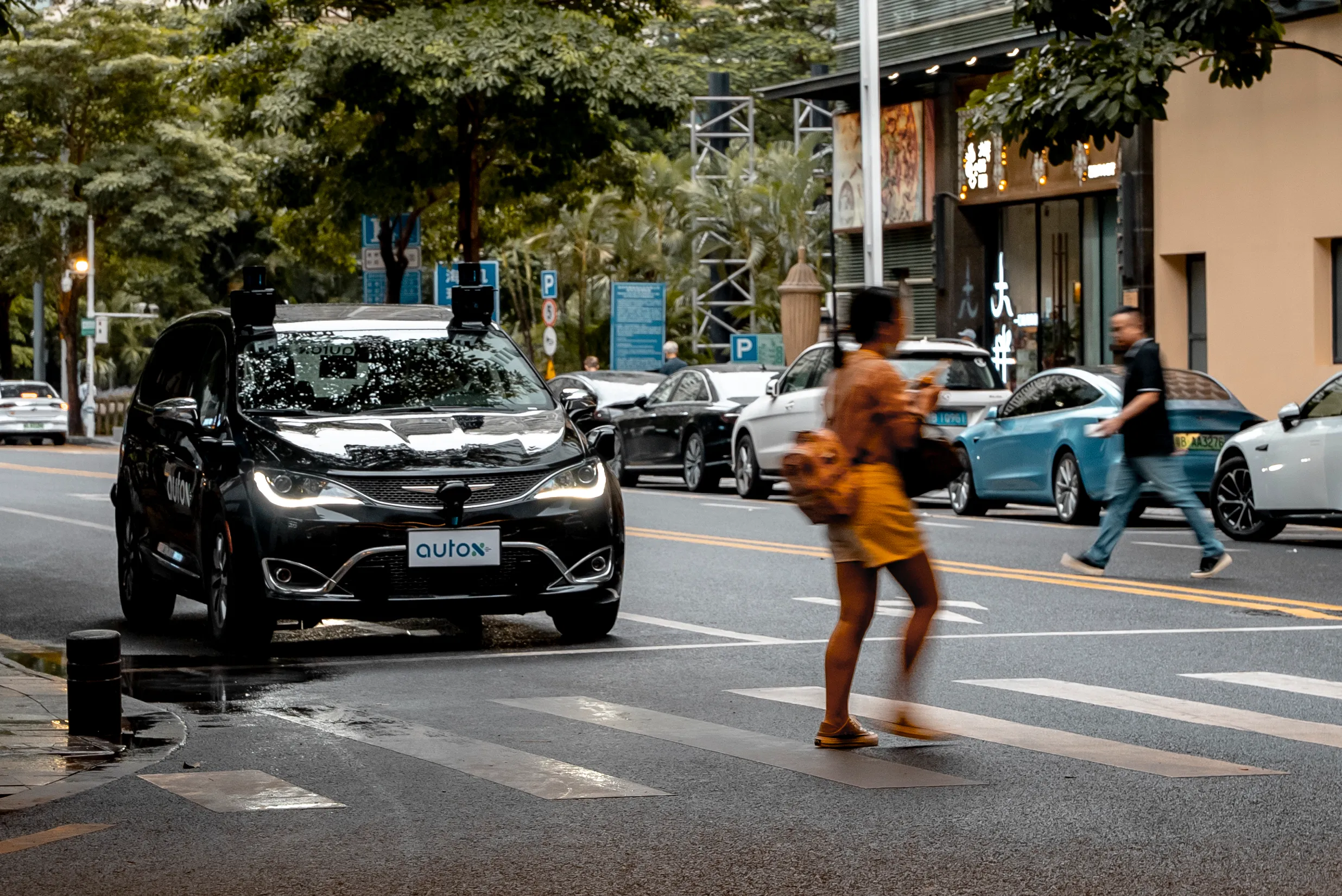 AutoX FCA Pacifica hybrid robotaxi on street