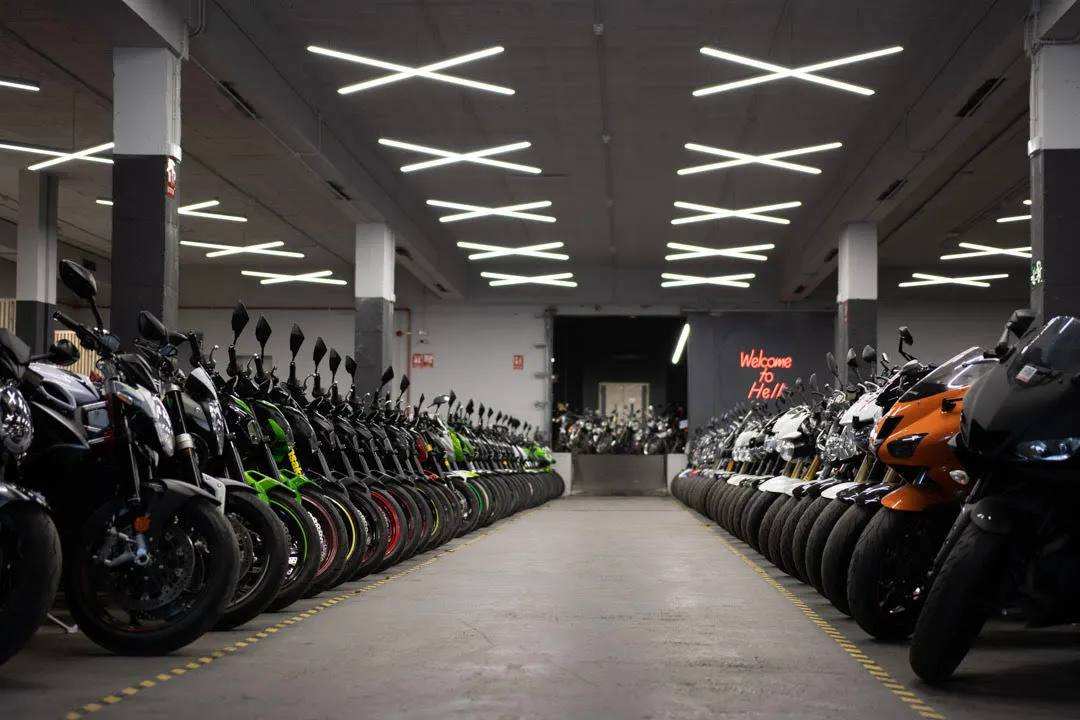 Row of used motorcycles at Mundimoto Headquarters Barcelona