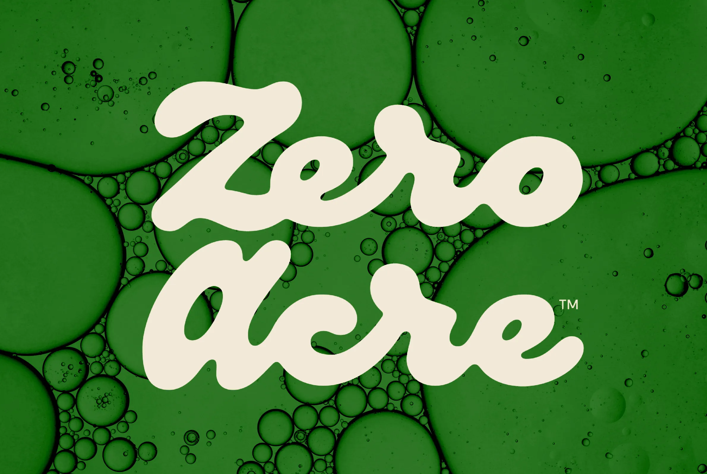 Composite image of Zero Acre's logo over a close-up of oil droplets.