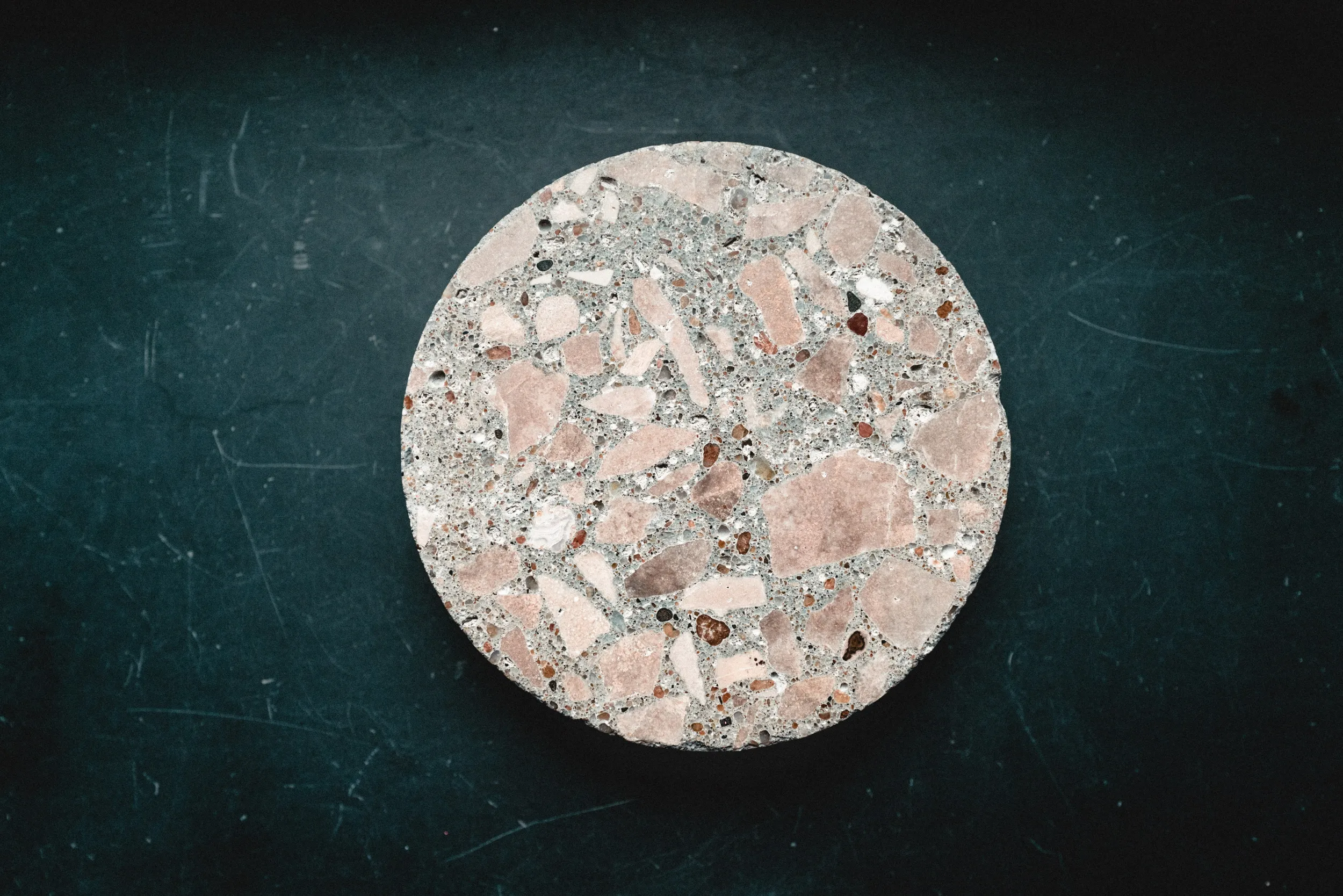 A puck of concrete created through an AI derived formula.
