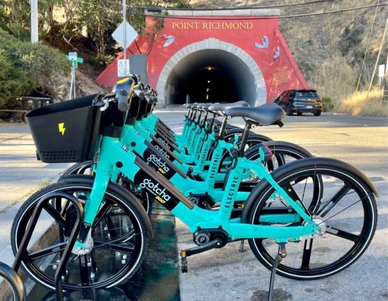 teal-colored e-bikes lined up in richmond, ca