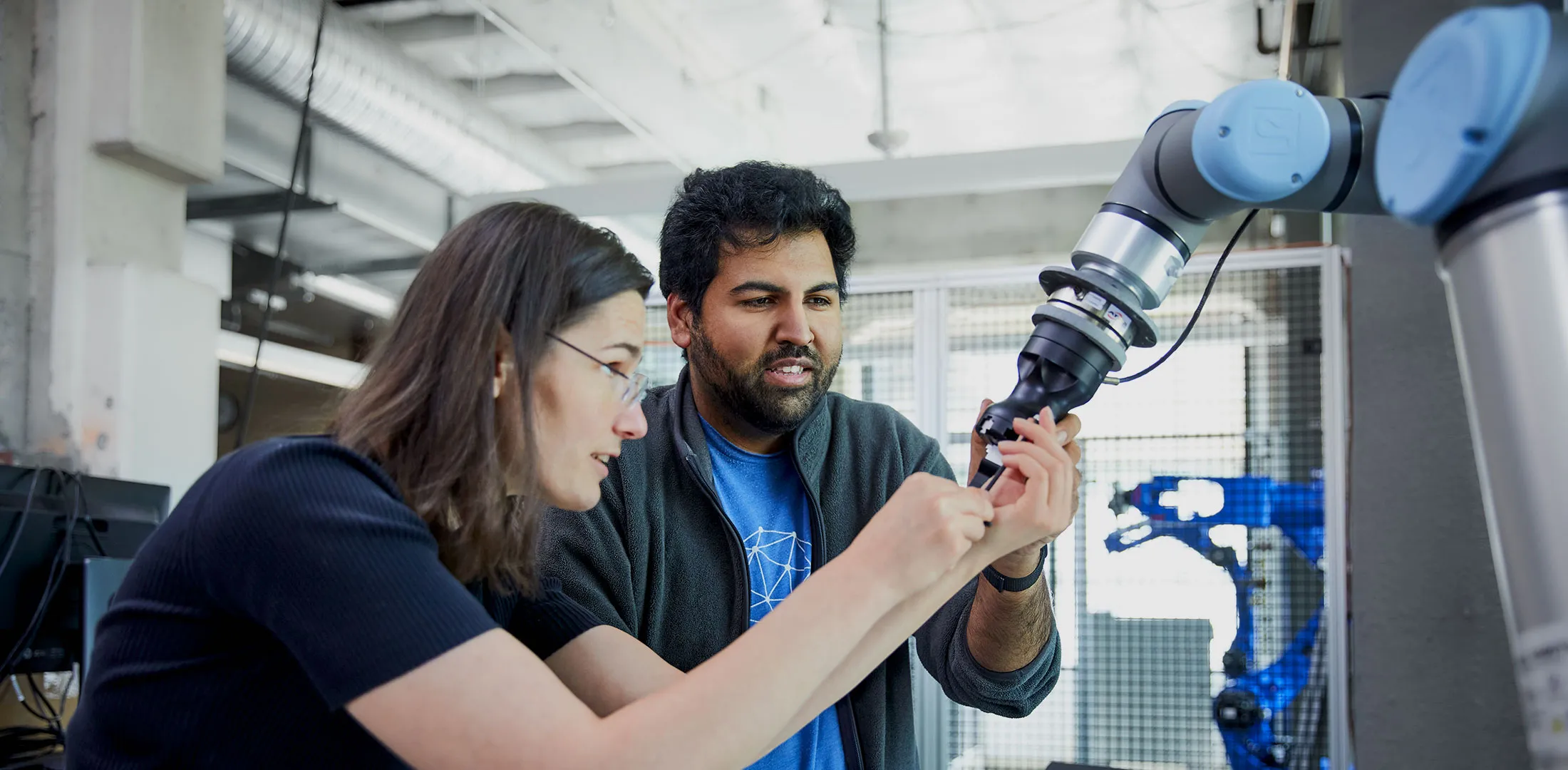 two in lab with robot