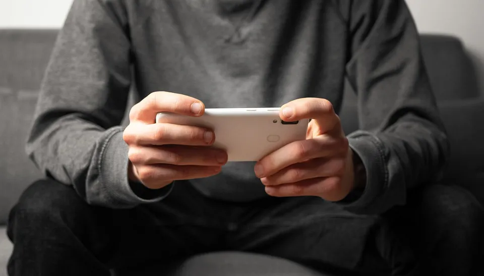 person looking at smartphone