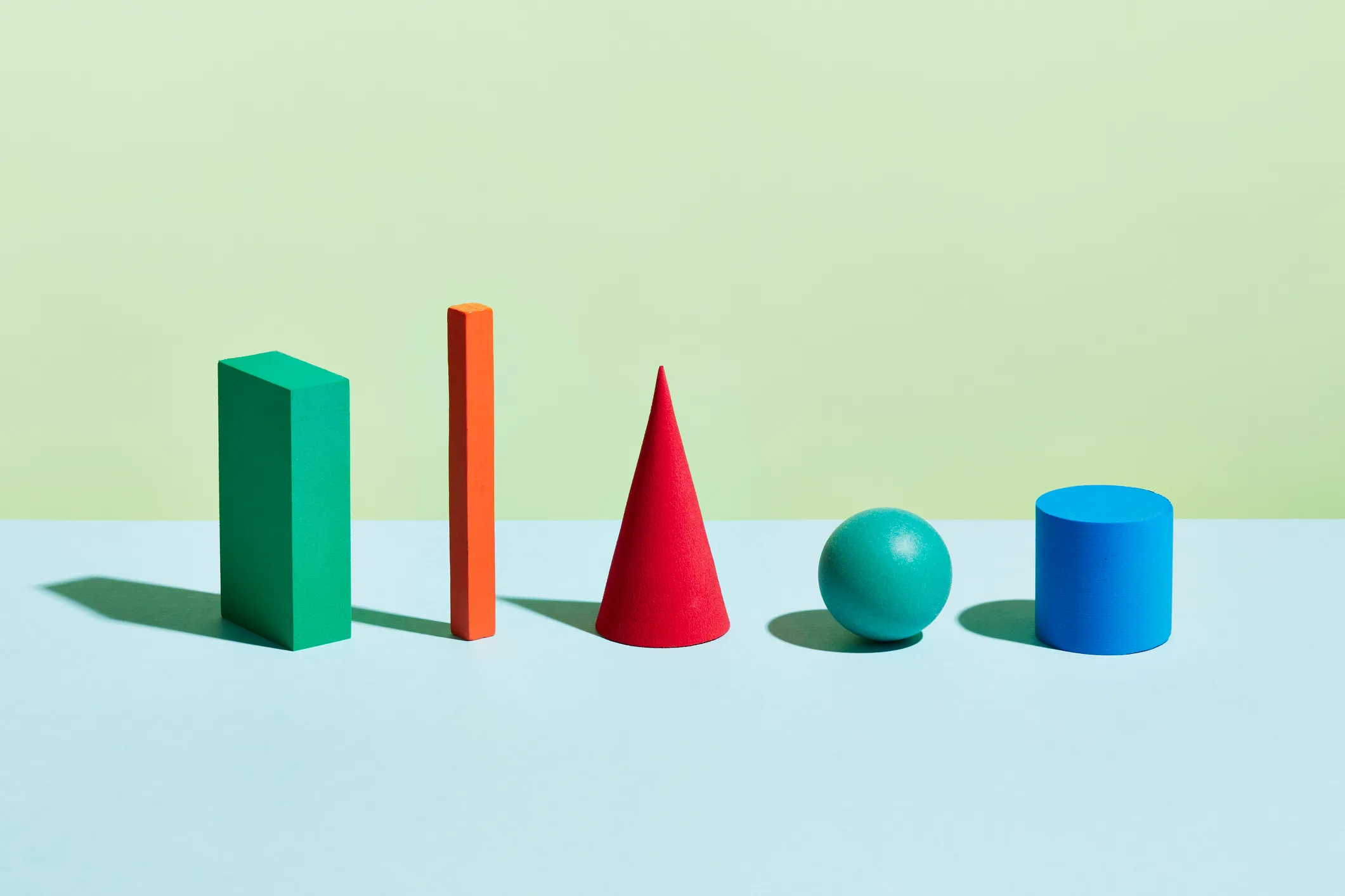 A row of geometric forms of different shapes and colours; developer tools metrics fundraising