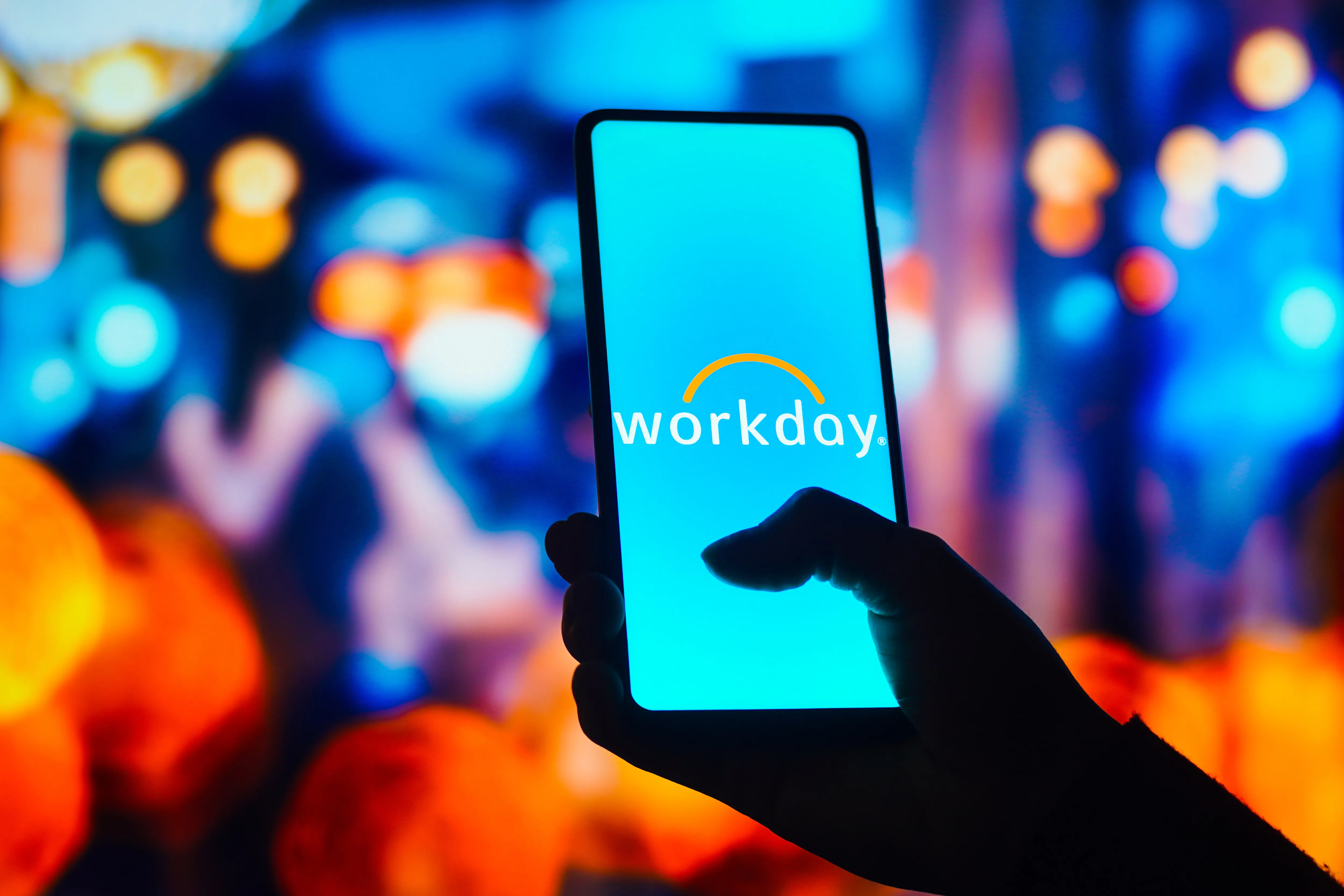 In this photo illustration, the Workday logo is displayed on