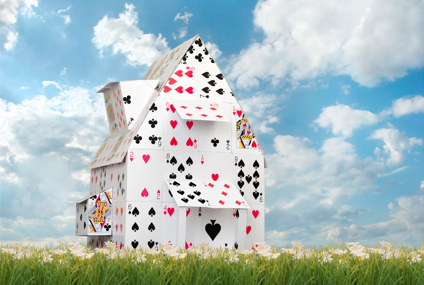 Card House Against Blue Skies