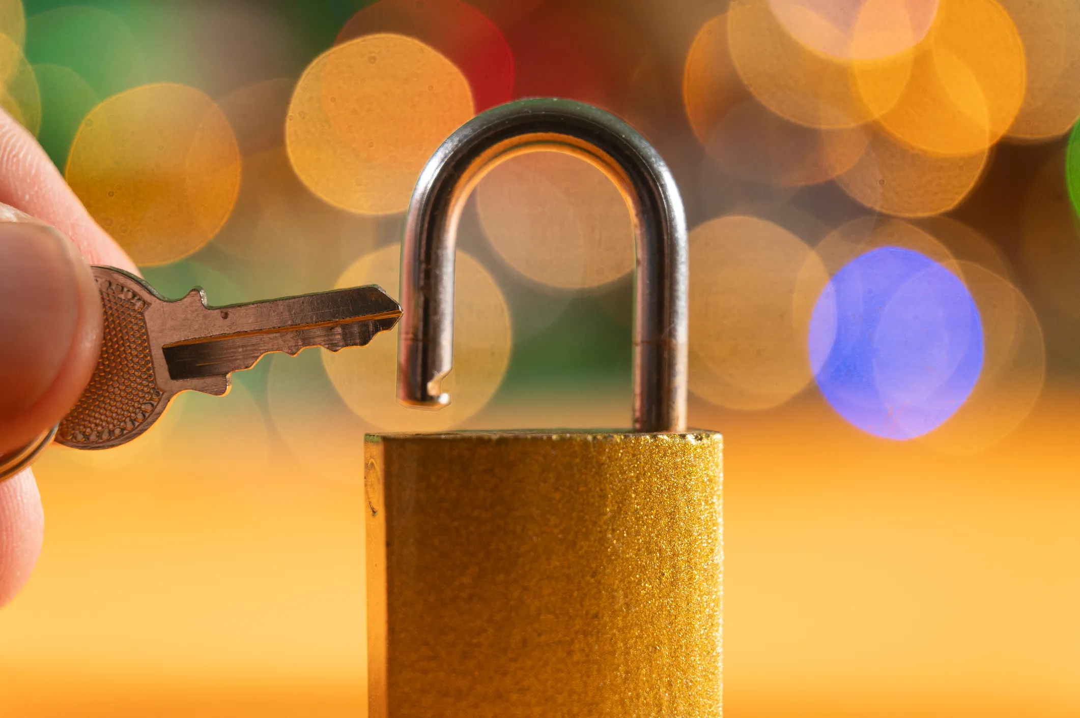 A hand holding a key next to a lock, used in post about Digip