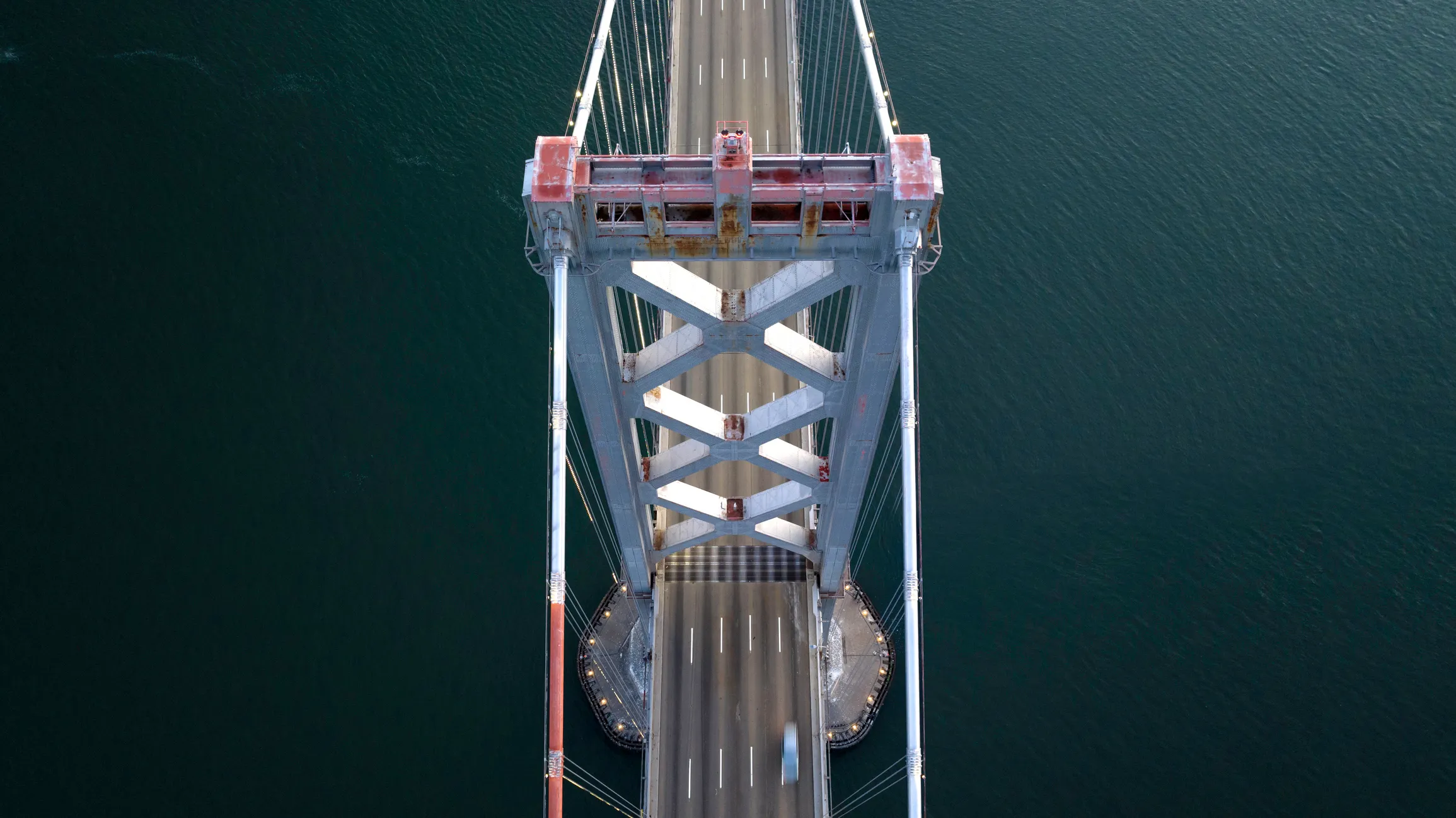 aerial photo looking down at early morning traffic on the San Francisco Bay Bridge.