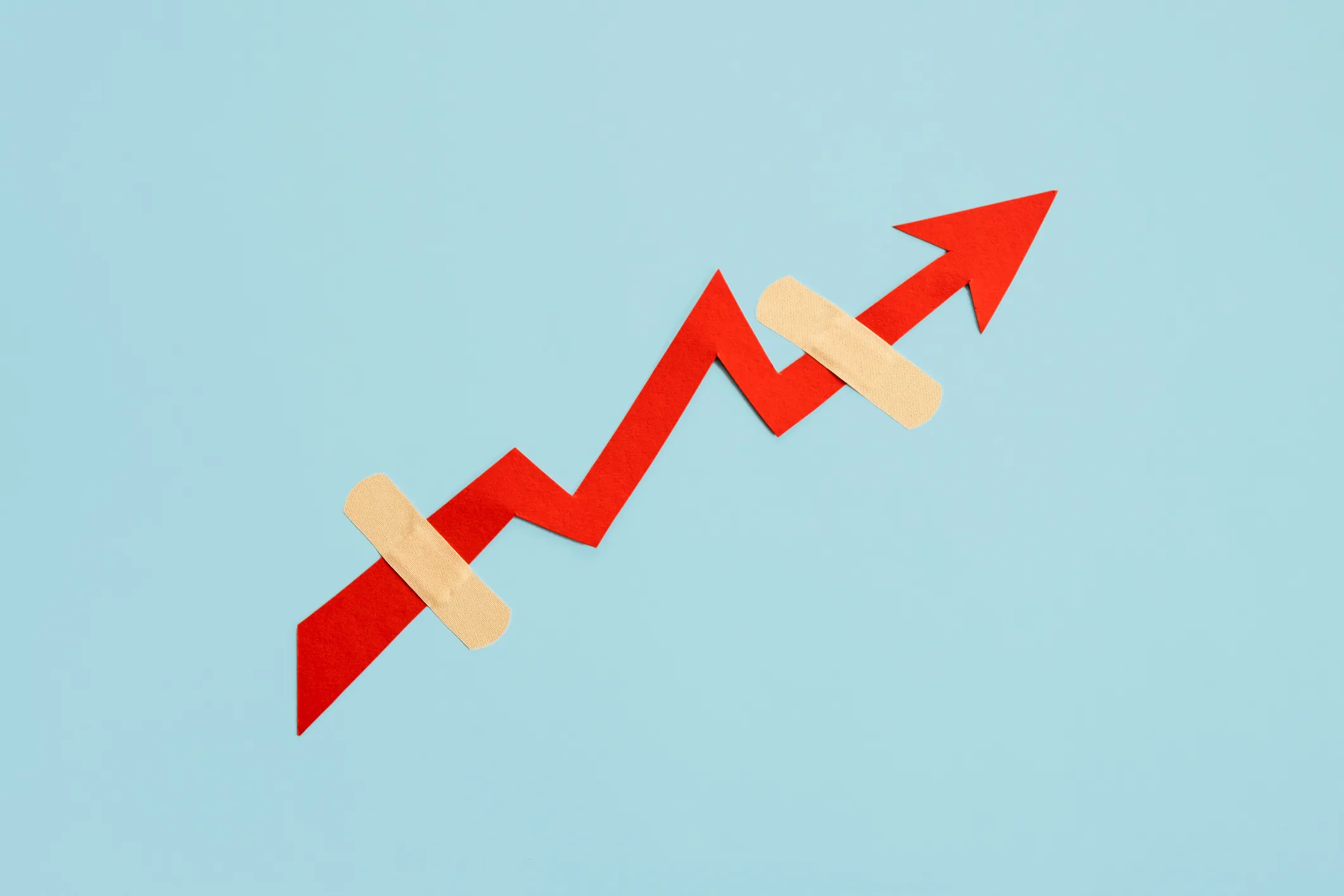 secondaries market illustrated with a red up arrow with two bandaids