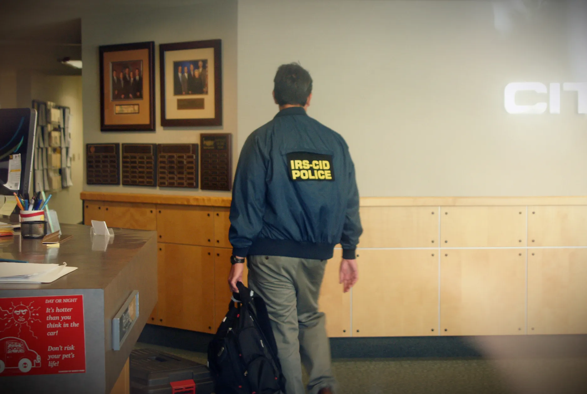 an IRS agent wearing an IRS-CID jacket