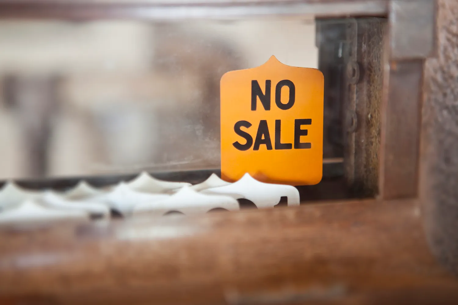 A 'NO SALE' sign on an Antique Cash Register