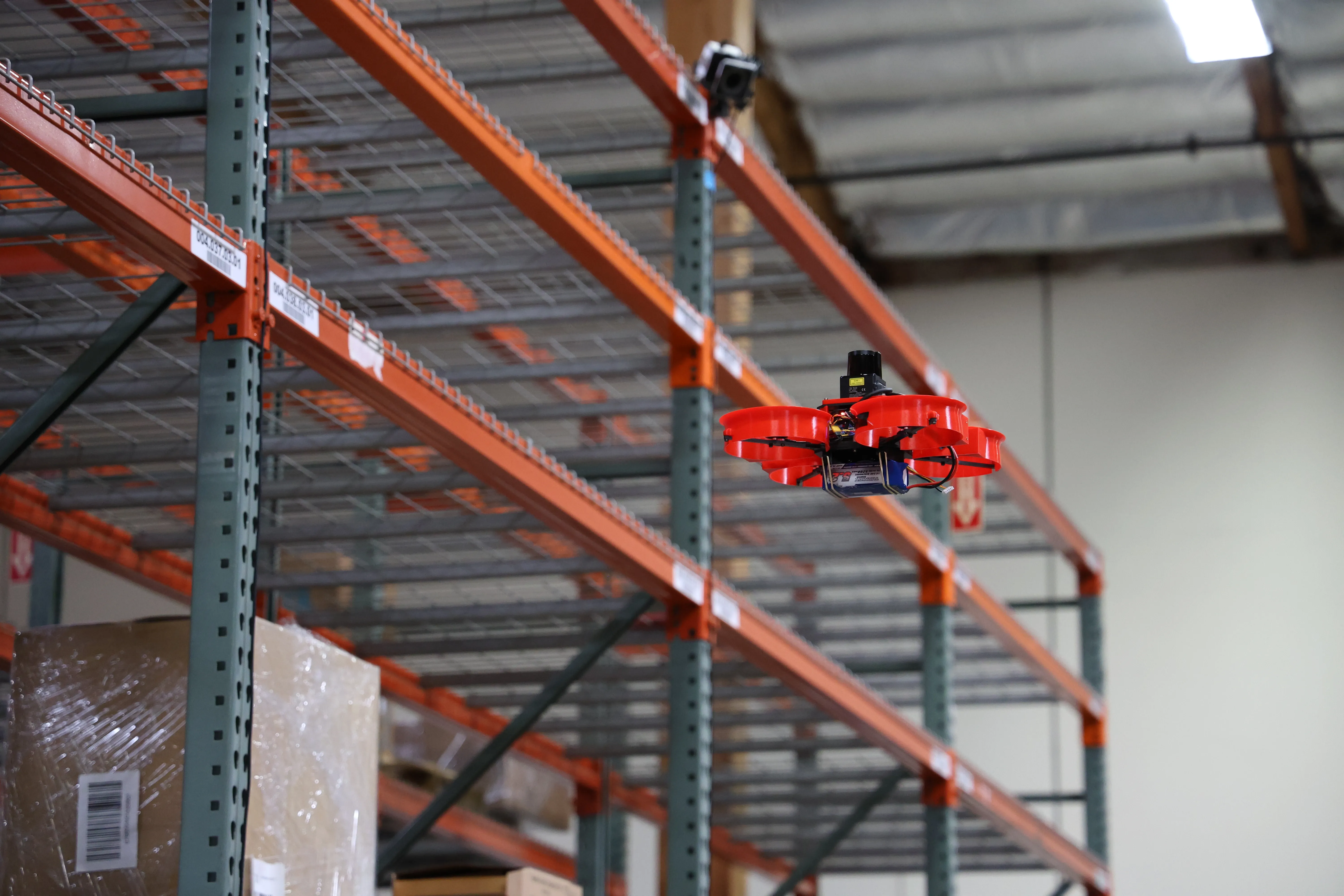 drone flying thru warehouse
