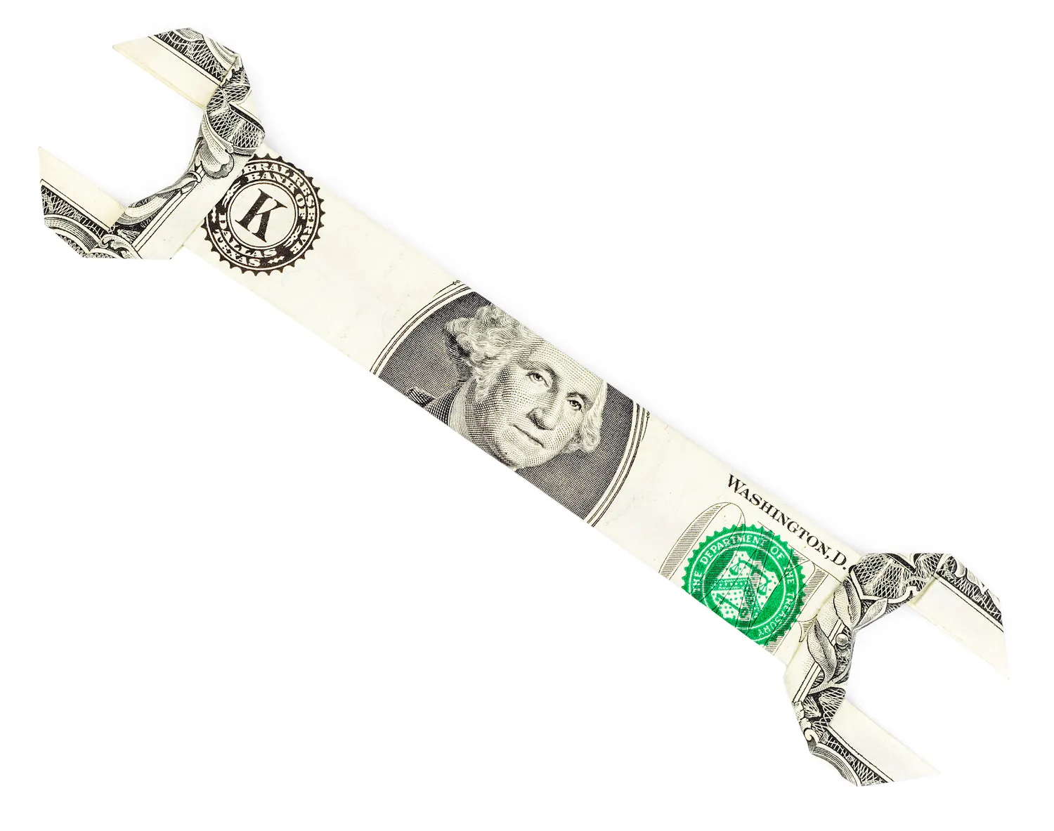 Dollar origami spanner wrench isolated on white background. Moneygami.