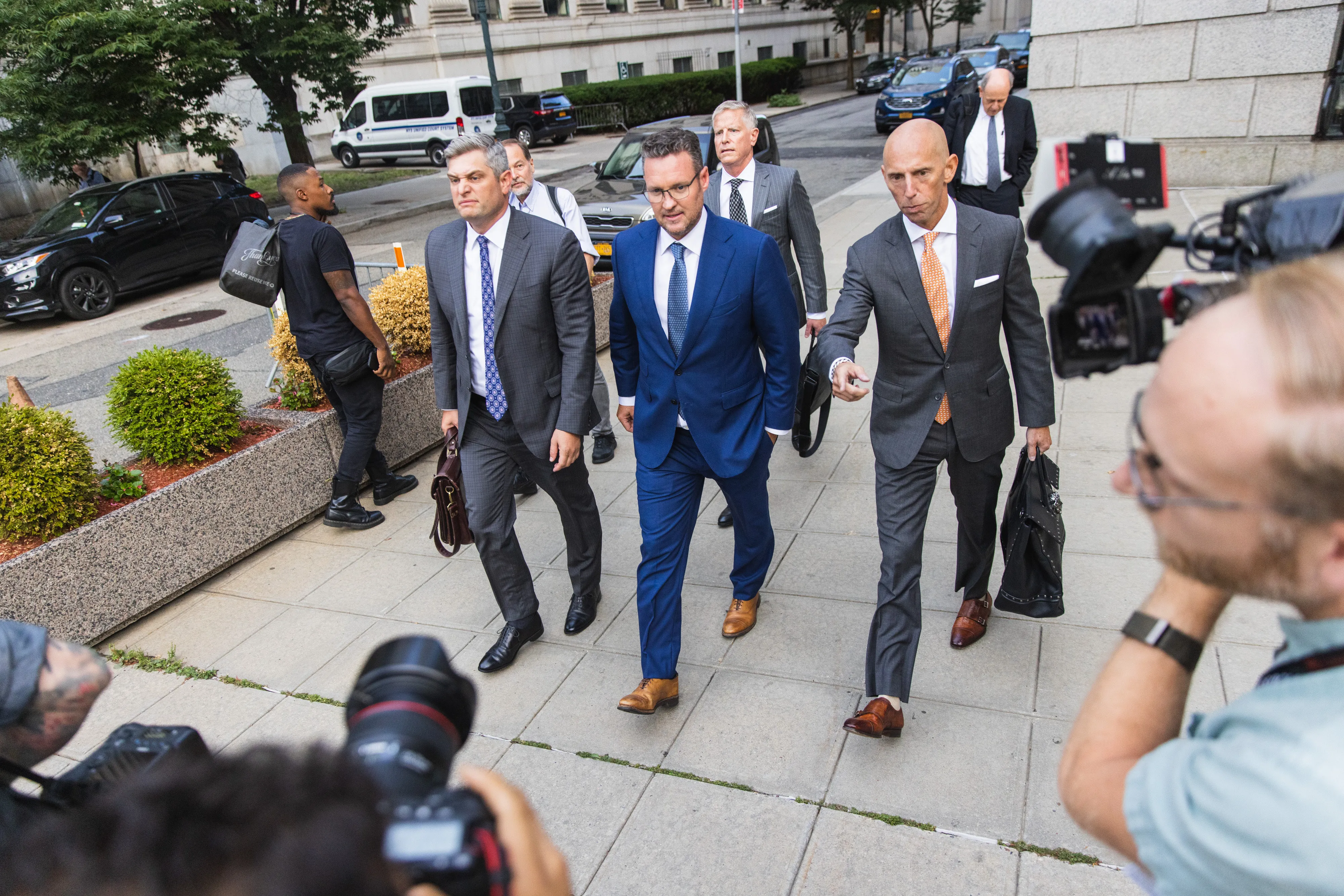 Trevor Milton, founder of Nikola Corp., center, exits court in New York, US