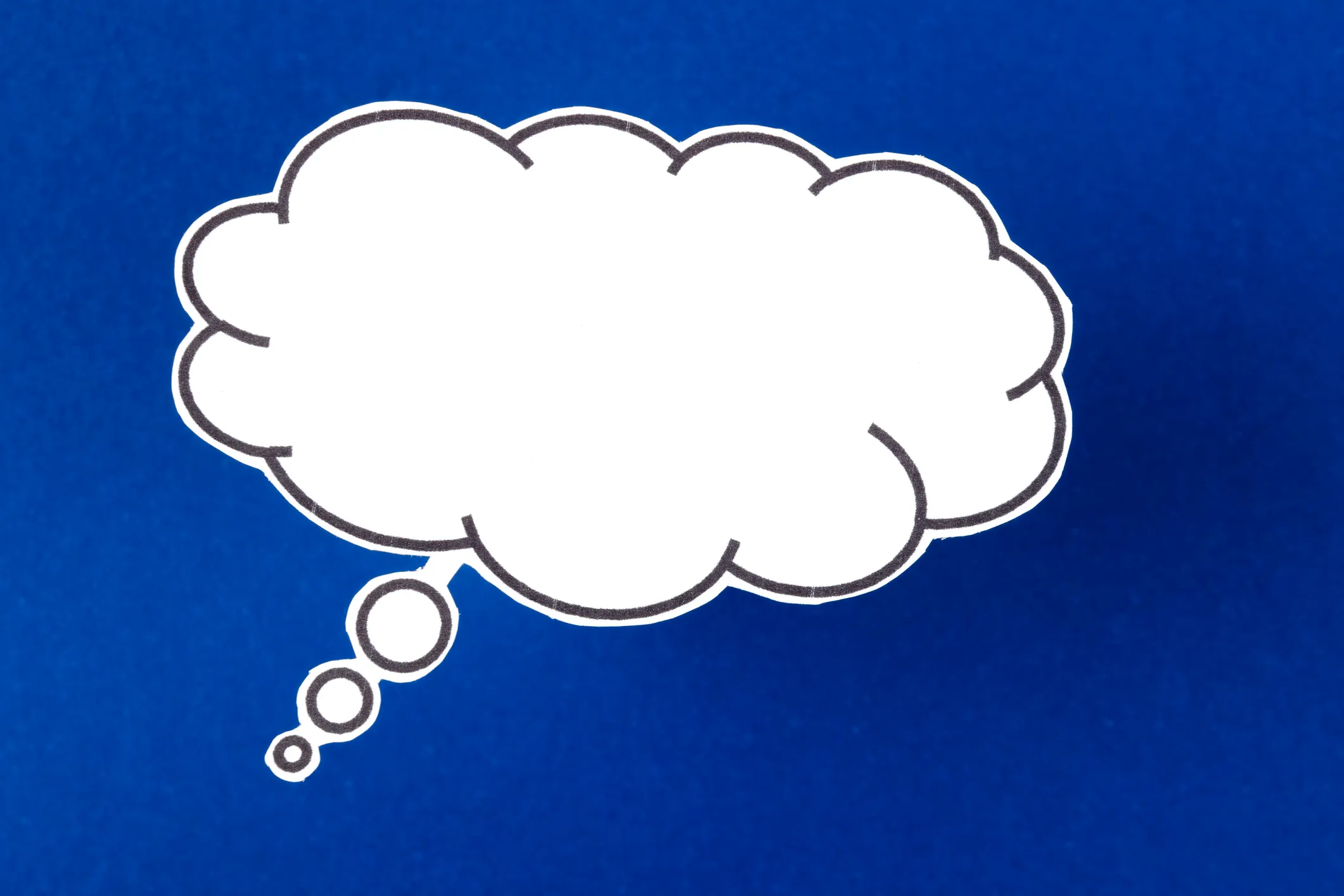 The words talking and speaking are conveyed by a speech bubble with copy space on a blue color background.
