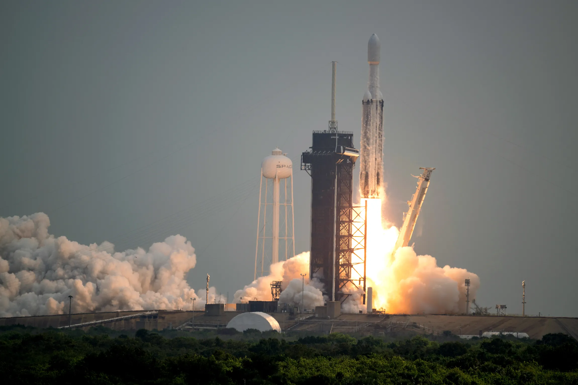 A SpaceX Falcon Heavy rocket with the Psyche spacecraft onboard is launched from Launch Complex 39A.