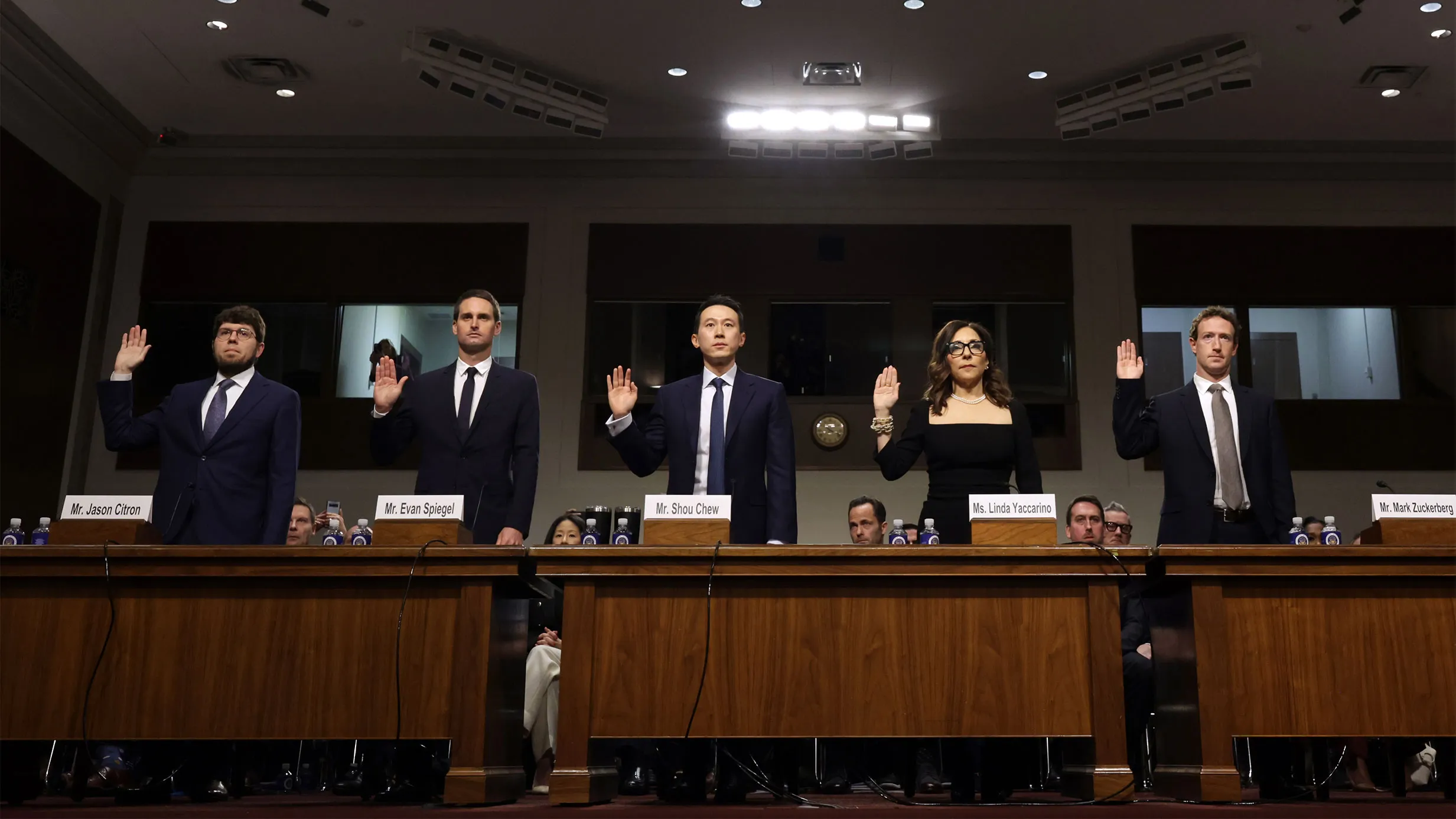 WASHINGTON, DC - JANUARY 31: (L-R) Jason Citron, CEO of Discord, Evan Spiegel, CEO of Snap, Shou Zi Chew, CEO of TikTok, Linda Yaccarino, CEO of X, and Mark Zuckerberg, CEO of Meta are sworn in as they testify before the Senate Judiciary Committee at the Dirksen Senate Office Building on January 31, 2024 in Washington, DC. The committee heard testimony from the heads of the largest tech firms on the dangers of child sexual exploitation on social media. (Photo by Alex Wong/Getty Images)