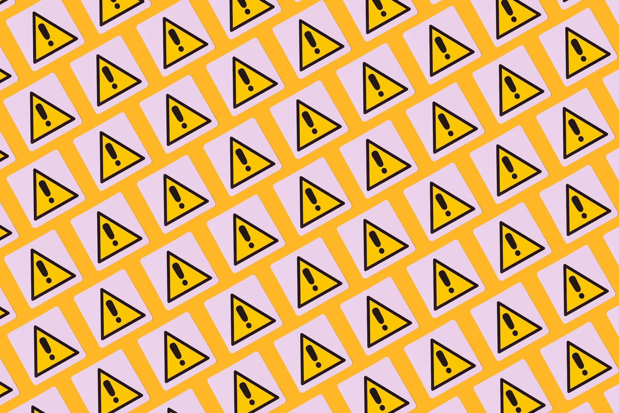 yellow warning symbols with exclamation points on a patterned background