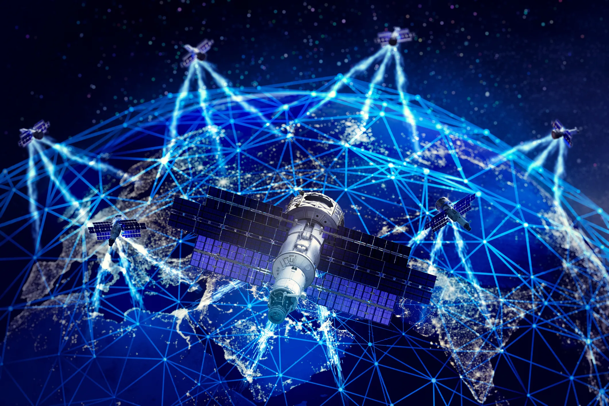 Satellites in earth orbit over blue tinted earth.
