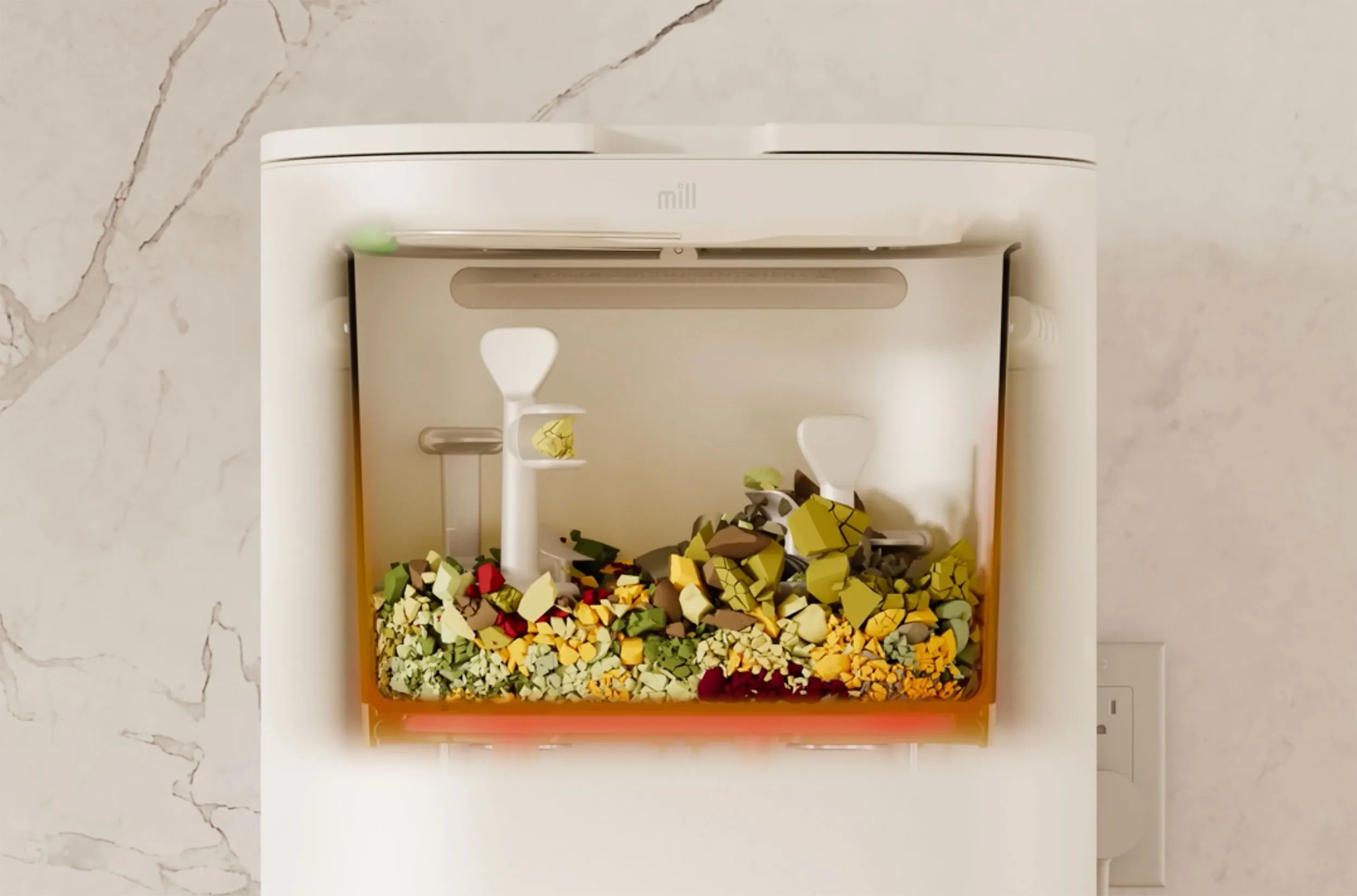 Mill bin grinding food waste in a cutaway view.