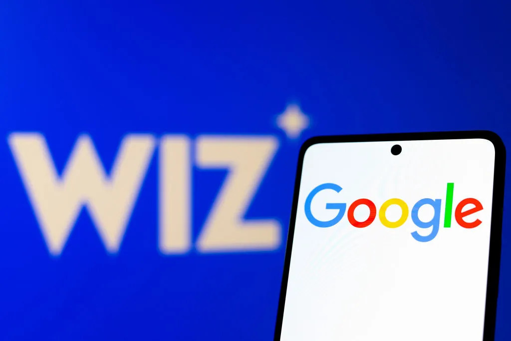 Image of Wiz's logo with a phone that says Google in front of it.