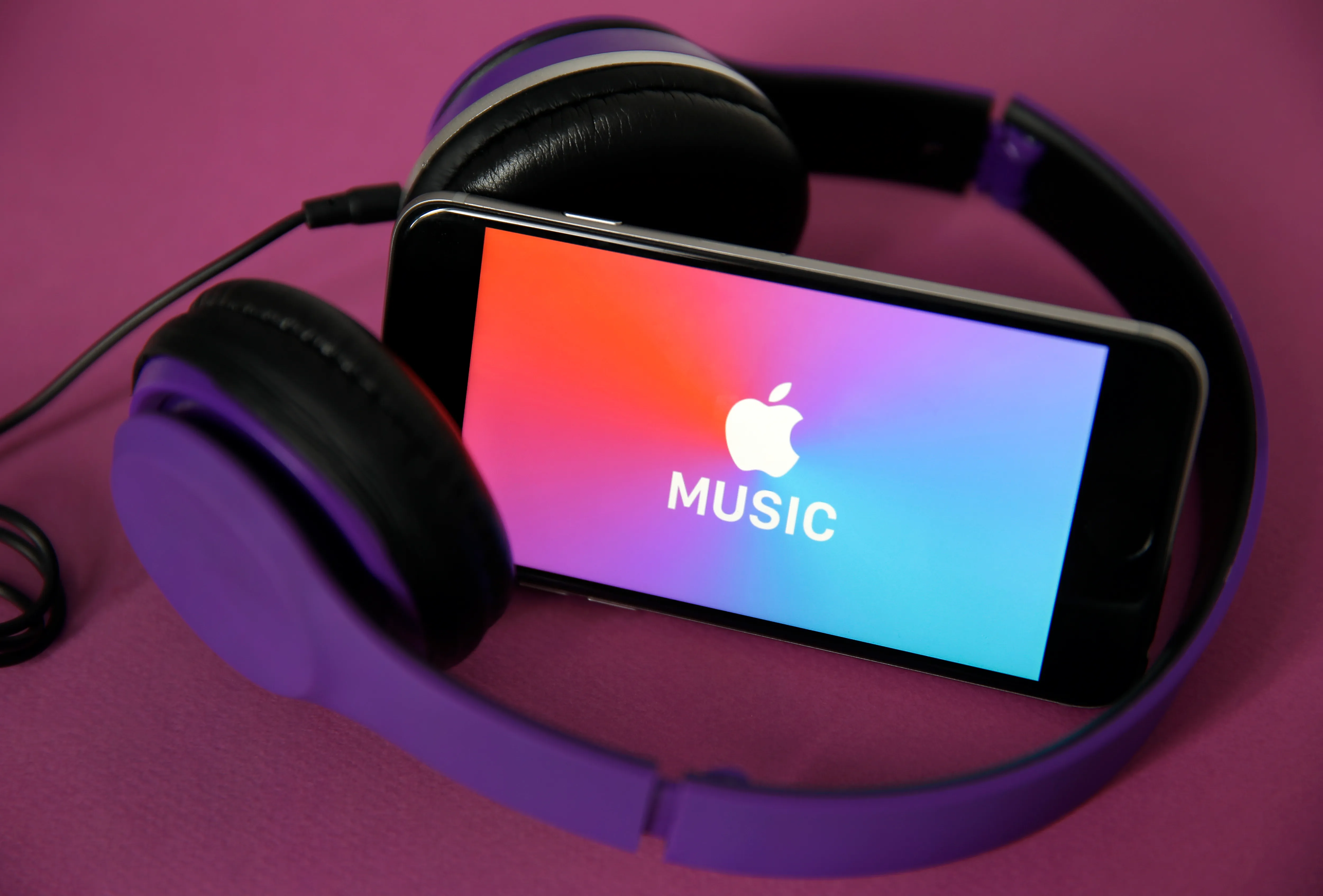 the logo of the music streaming platform Apple Music is displayed on the screen of an iPhone
