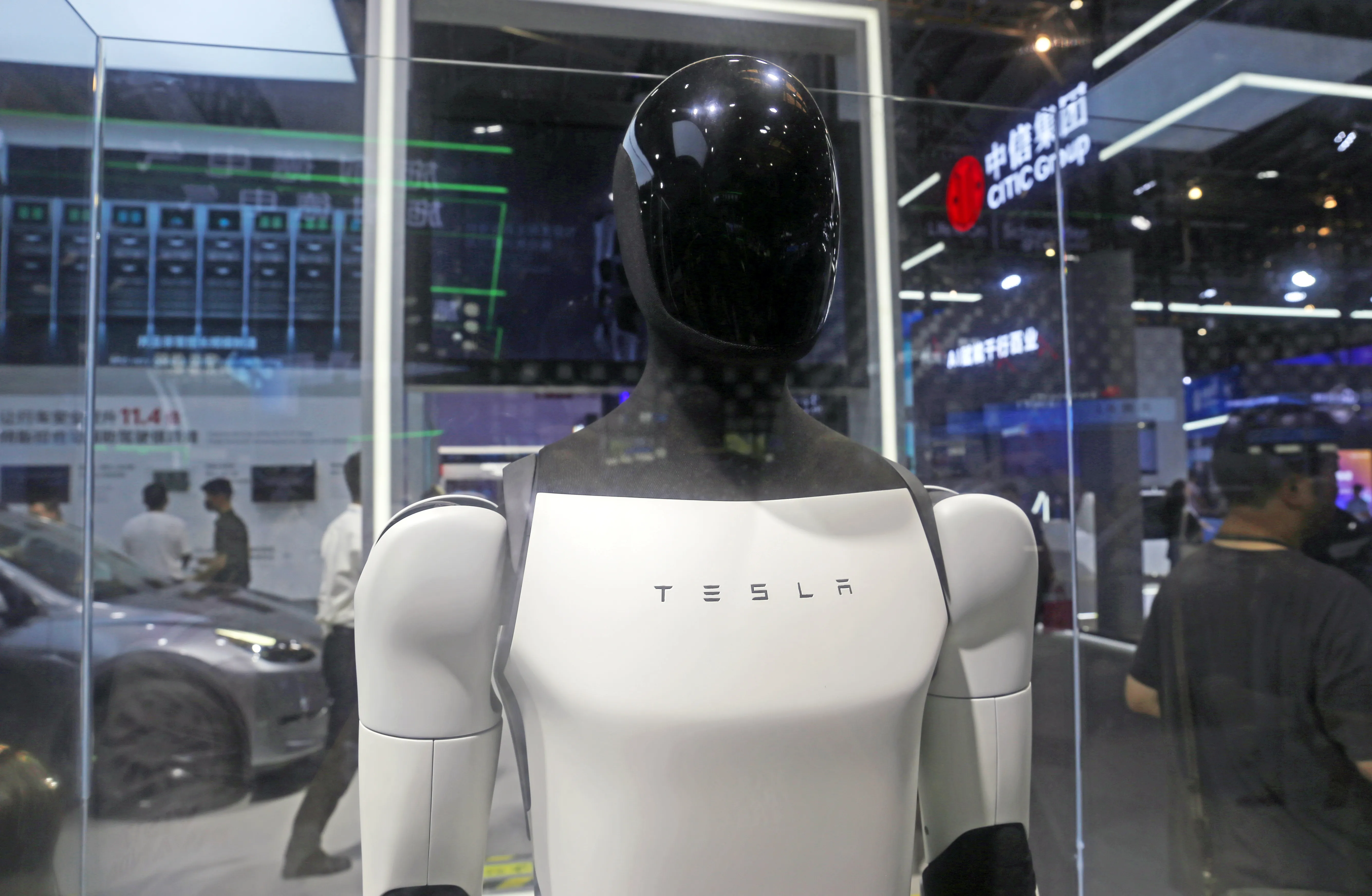 Visitors are viewing Tesla's humanoid robot Optimus Prime II at WAIC in Shanghai, China, on July 7, 2024.