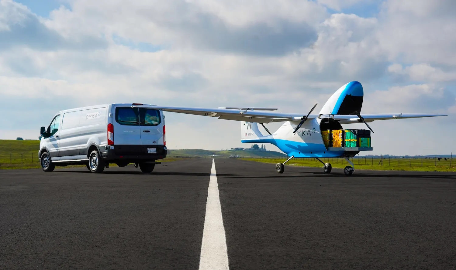 Pyka Pelican Cargo 4 parked on tarmac next to delivery van