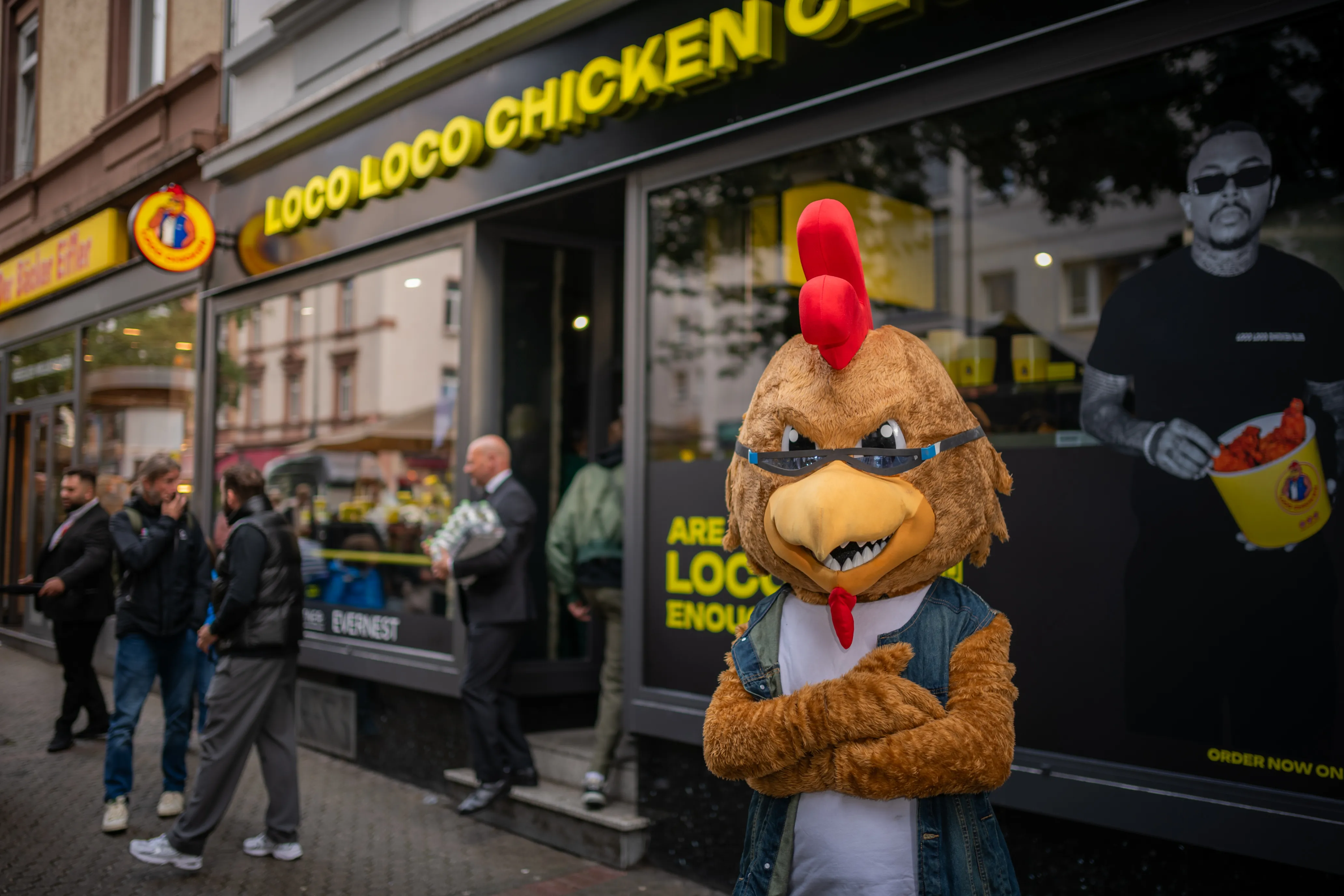 Loco Chicken mascot in front of store