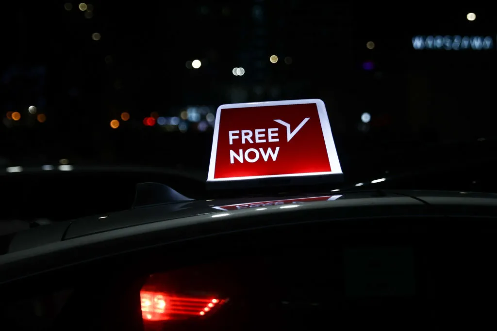 FreeNow taxi sign is seen on a car in Warsaw, Poland on February 24, 2024.