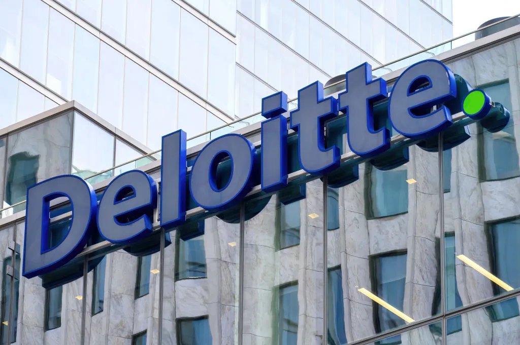 Deloitte sign on a building facade.