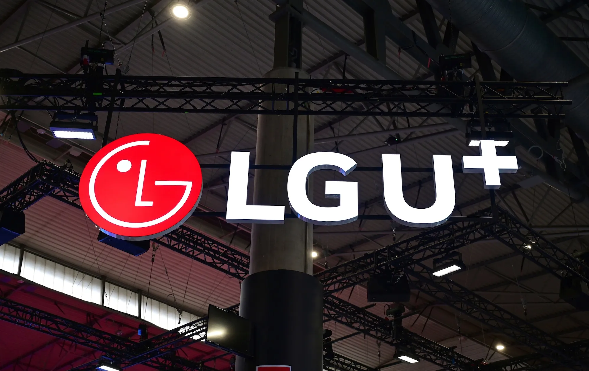 Logo of the South Korean company LG U+ (LG Uplus) is displayed during the Mobile World Congress. Logos of companies exhibited at MWC 2025.