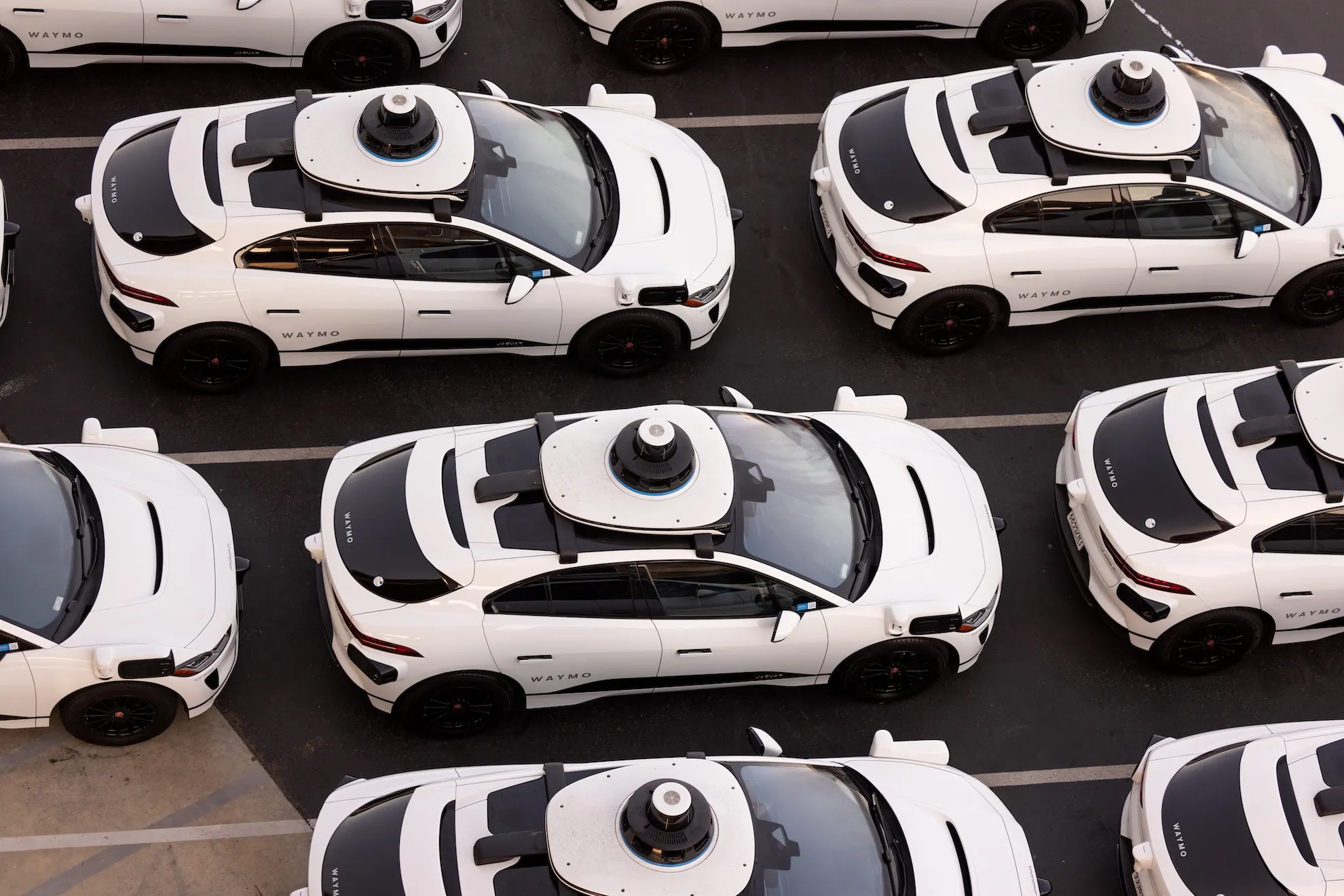 Aerial view of Waymo's self-driving car fleet storage facility in San Francisco.