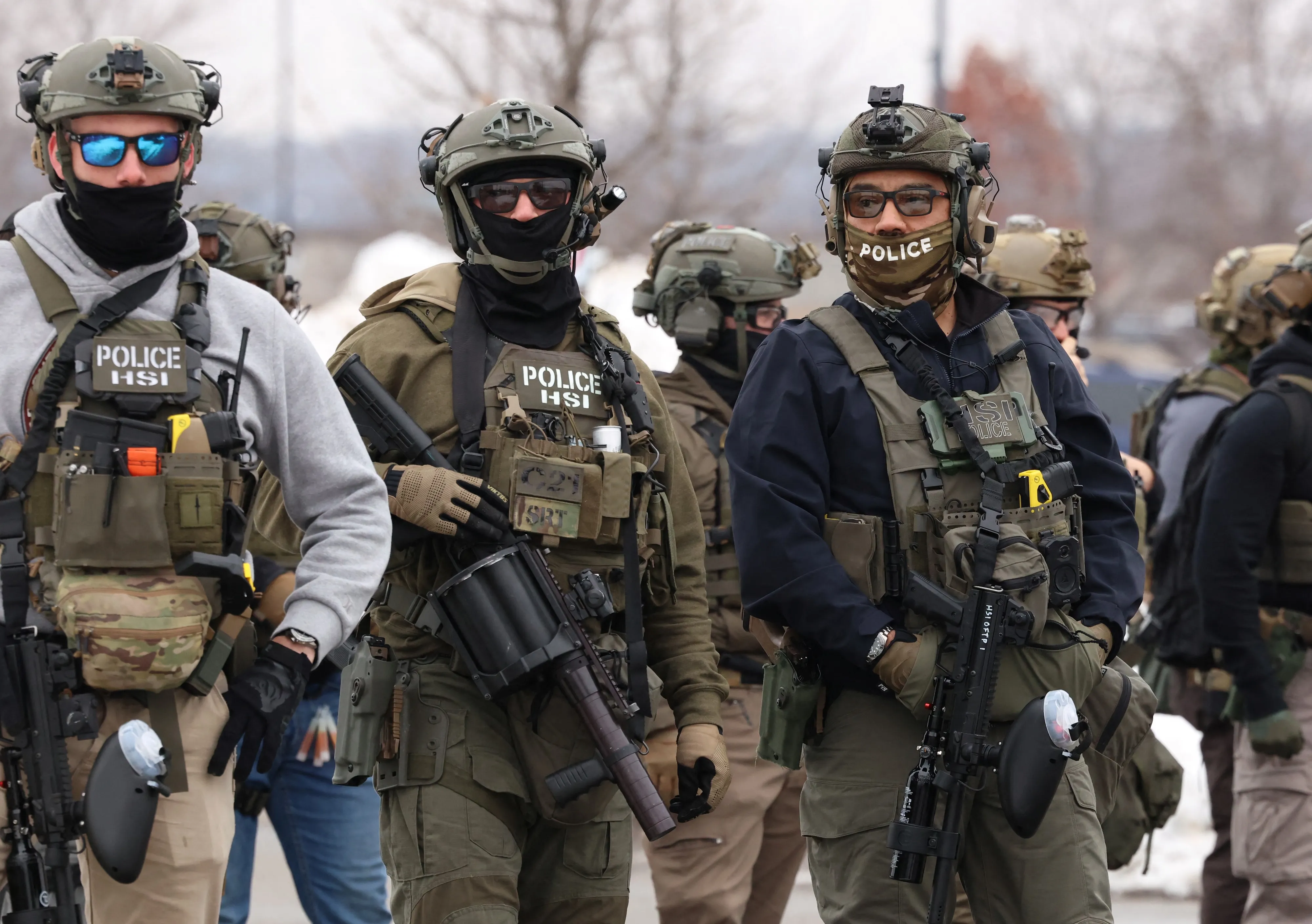 US Homeland Security Investigations (HSI) agents stand guard at the Bishop Henry Whipple Federal Building in Minneapolis, Minnesota, on January 8, 2026.